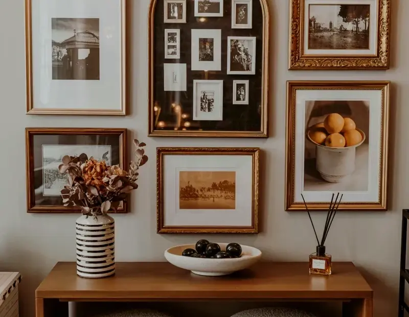 Small Entryway Gallery Wall Ideas with Warm Tones and Vintage Frames